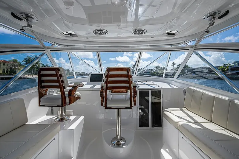 Slide: The Image of Luxurious interior of 2021 Viking 38 Open yacht with elegant seating and panoramic windows. - 35