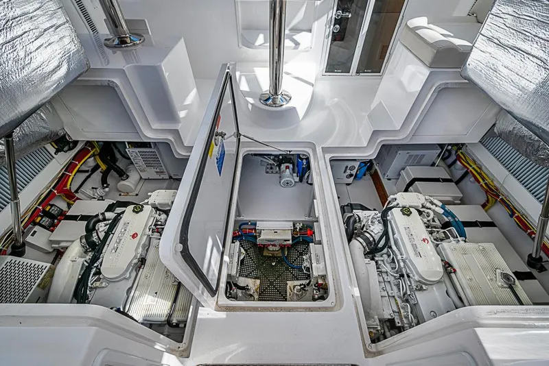 Slide: The Image of Engine room of 2021 Viking 38 Open yacht, showcasing dual engines and clean layout. - 37