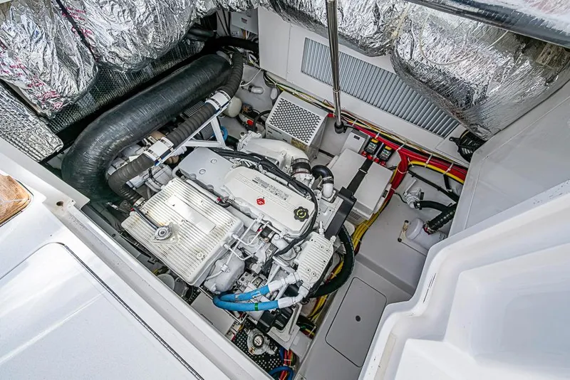 Slide: The Image of Engine compartment of 2021 Viking 38 Open boat, showcasing detailed mechanical components. - 40