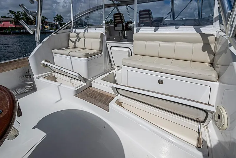 Slide: The Image of 2021 Viking 38 Open yacht interior with cushioned seating and storage compartments. - 48