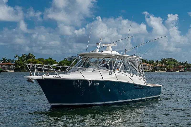 Slide: The Image of 2021 Viking 38 Open boat on water under blue sky. - 5