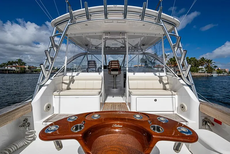 Slide: The Image of 2021 Viking 38 Open yacht interior with seating and fishing rod holders. - 51