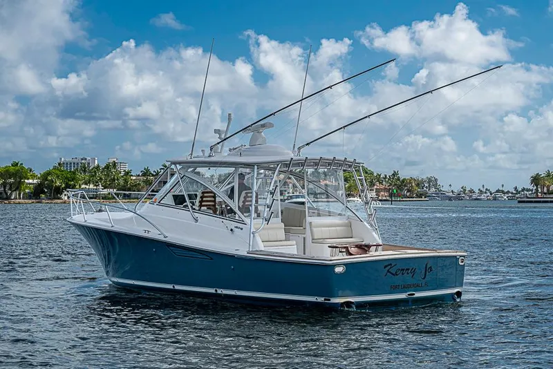 Slide: The Image of 2021 Viking 38 Open yacht on water, clear sky, Fort Lauderdale backdrop. - 55