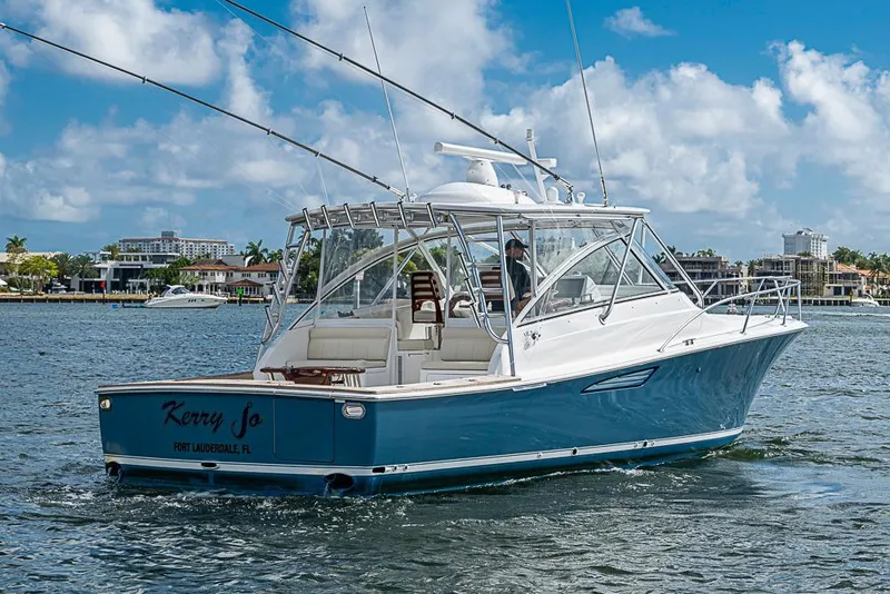 Slide: The Image of 2021 Viking 38 Open yacht cruising in Fort Lauderdale waters under a clear blue sky. - 57