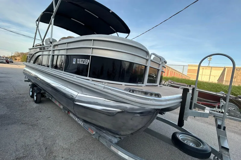 Slide: The Image of Trailer hitch of a 2014 Bennington G22 on asphalt surface. - 11