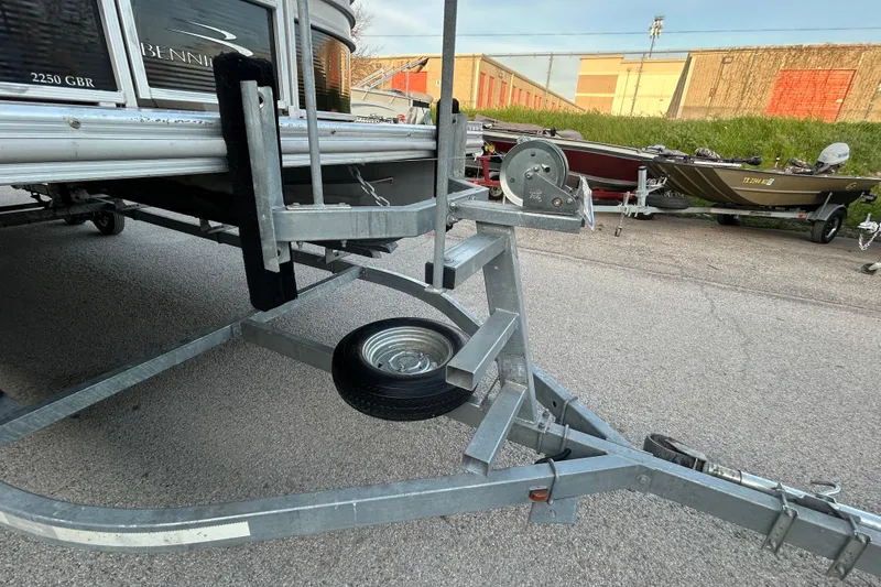 Slide: The Image of 2014 Bennington G22 pontoon boat with outboard motor on trailer. - 12