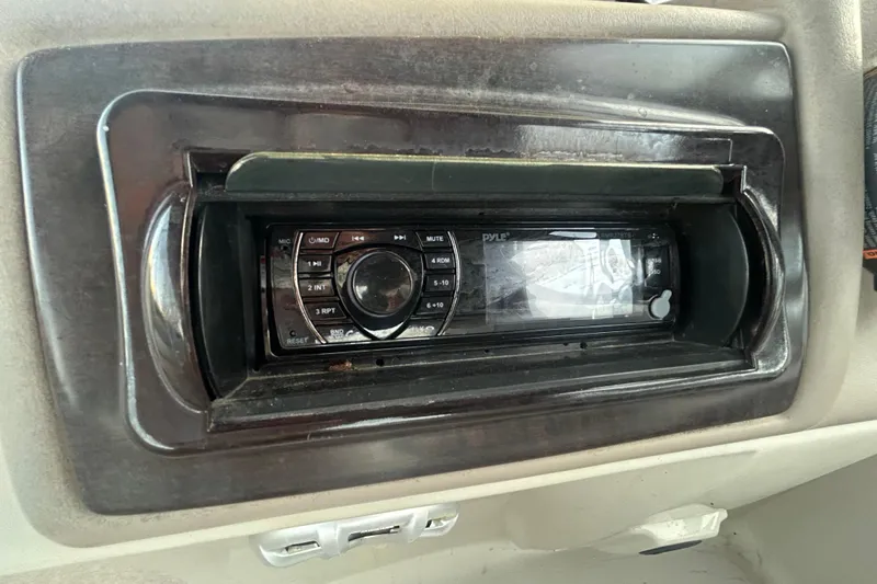 Slide: The Image of 2014 Bennington G22 boat interior with sink, cushioned seating, and sleek design. - 29