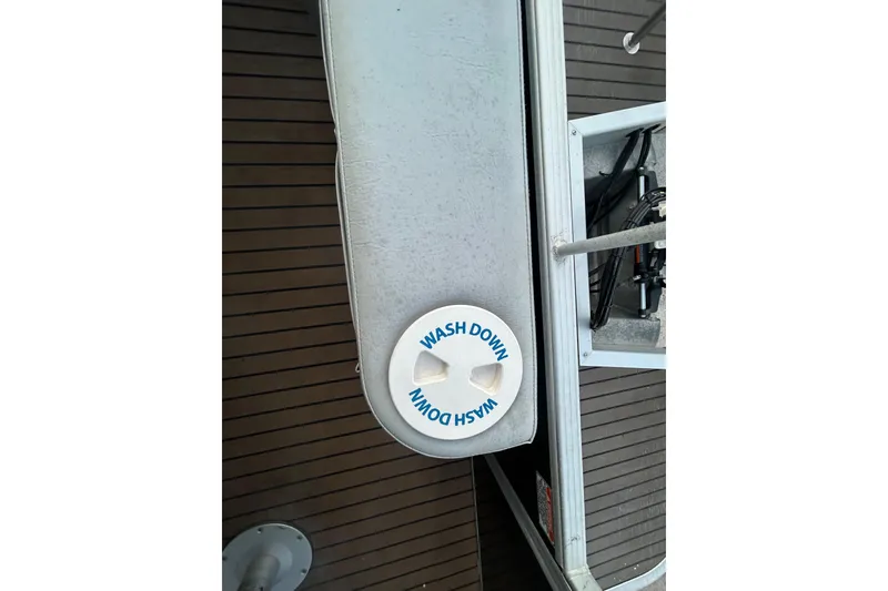 Slide: The Image of 2014 Bennington G22 pontoon boat with canopy, spacious seating, and sleek design. - 33