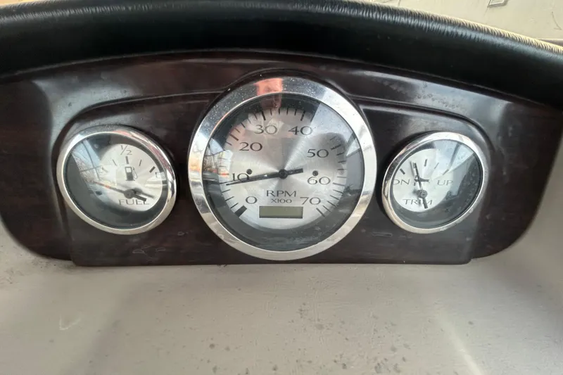 Slide: The Image of Storage compartment in a 2014 Bennington G22 boat, featuring a black interior. - 34