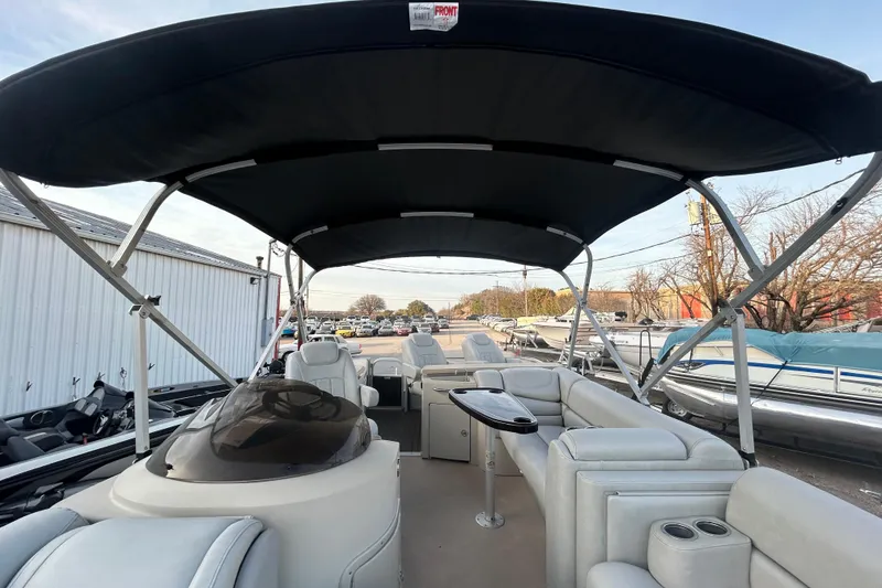 Slide: The Image of Trailer wheels of a 2014 Bennington G22 on a textured pavement. - 35