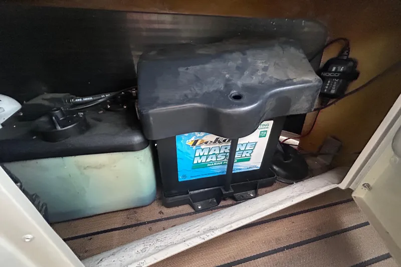 Slide: The Image of Laptop displaying engine diagnostics for 2014 Bennington G22 boat under sunlight. - 38