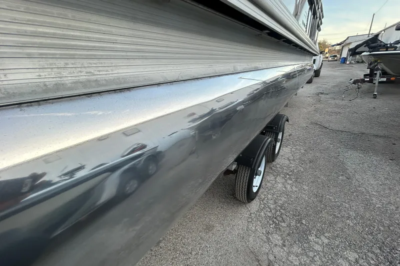Slide: The Image of 2014 Bennington G22 pontoon boat with Evinrude outboard motor on trailer. - 6