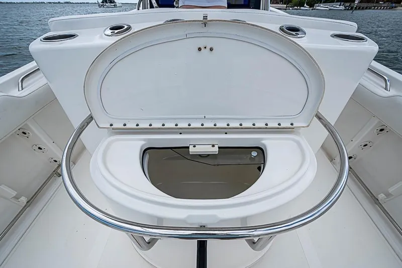 Slide: The Image of 2007 Triton 351 CC boat with open storage compartment on deck. - 20