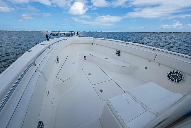 Slide: The Image of 2007 Triton 351 CC boat interior with spacious seating on open water. - 26