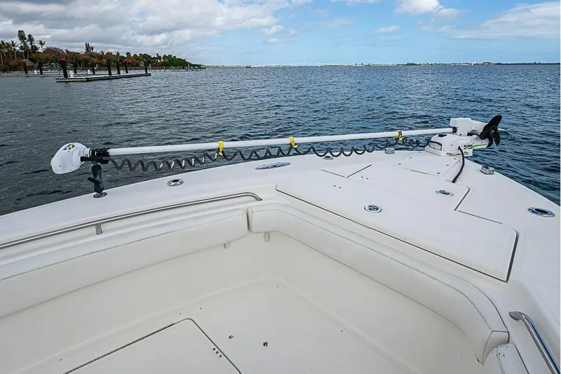 Slide: The Image of 2007 Triton 351 CC boat with trolling motor on calm water. - 30
