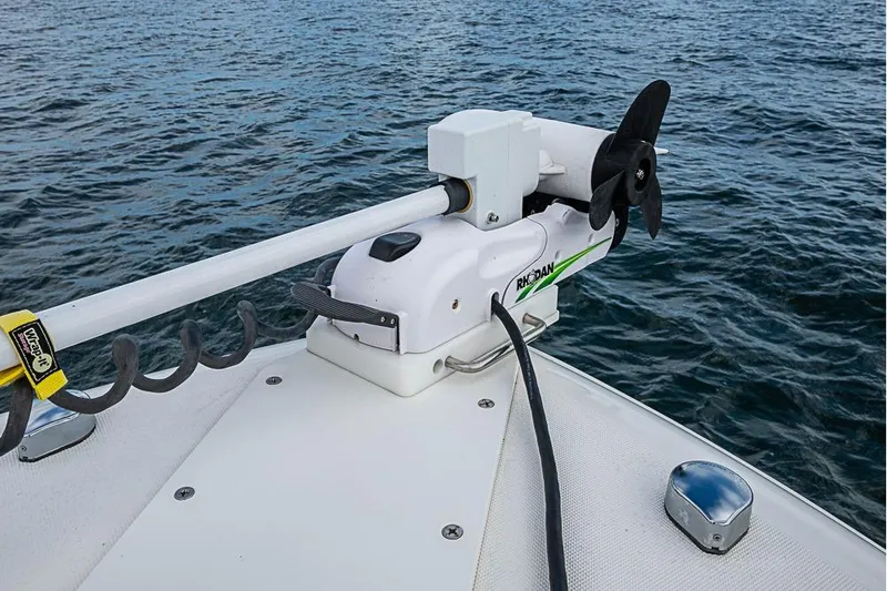 Slide: The Image of Triton 351 CC 2007 boat with Rhodan trolling motor on open water. - 32