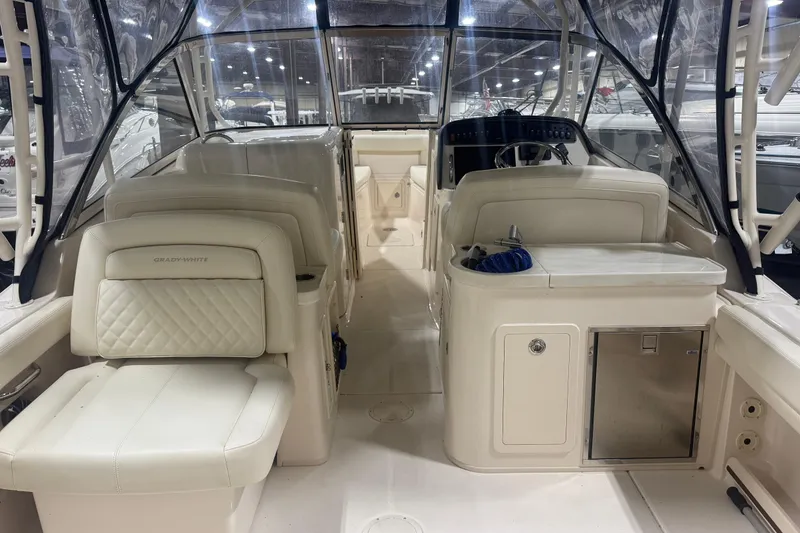 Slide: The Image of 2022 Grady-White Freedom 307 boat interior with seating and helm station. - 16