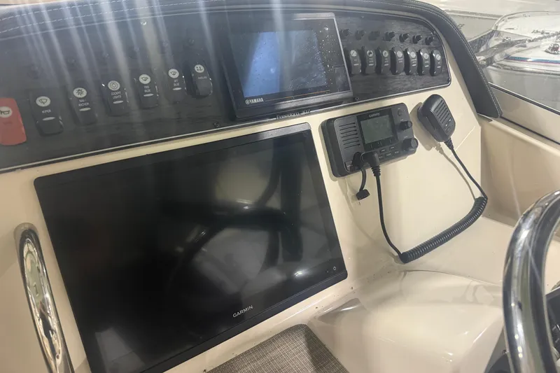 Slide: The Image of Control panel of 2022 Grady-White Freedom 307 boat with Garmin and Yamaha electronics. - 20