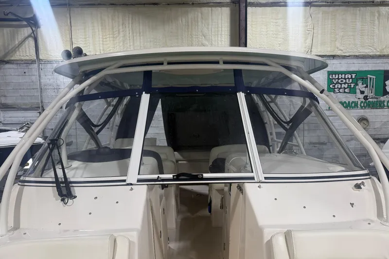 Slide: The Image of 2022 Grady-White Freedom 307 boat in indoor storage facility. - 23