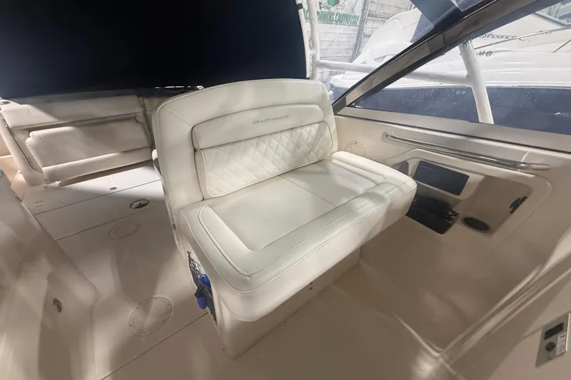 Slide: The Image of 2022 Grady-White Freedom 307 boat interior with white seating and modern design. - 27