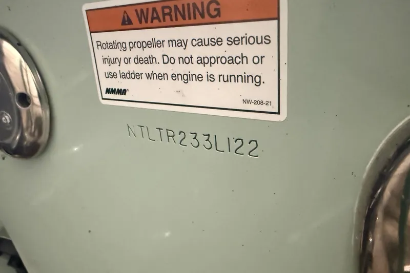 Slide: The Image of Warning label on 2022 Grady-White Freedom 307 boat with serial number. - 3