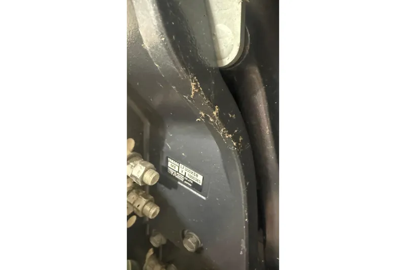 Slide: The Image of Close-up of a 2022 Grady-White Freedom 307 engine component with visible label. - 4