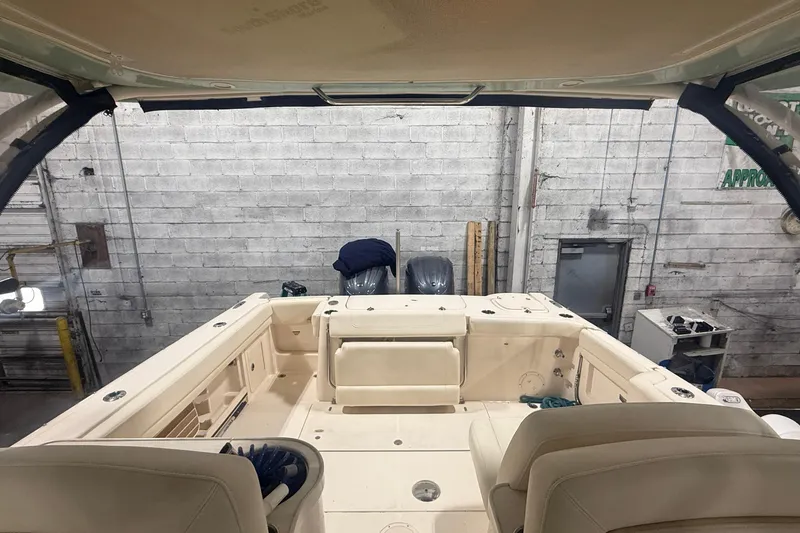 Slide: The Image of 2022 Grady-White Freedom 307 boat interior in a garage setting. - 7