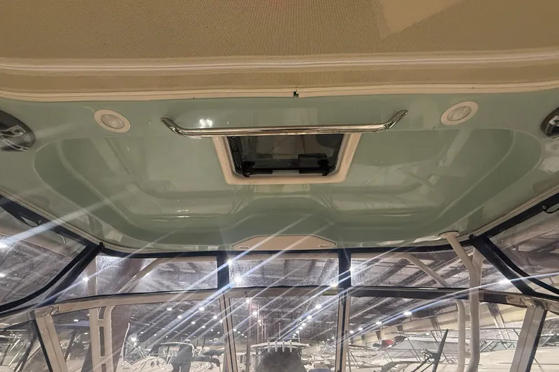 Slide: The Image of 2022 Grady-White Freedom 307 boat interior ceiling with hatch and lighting. - 9
