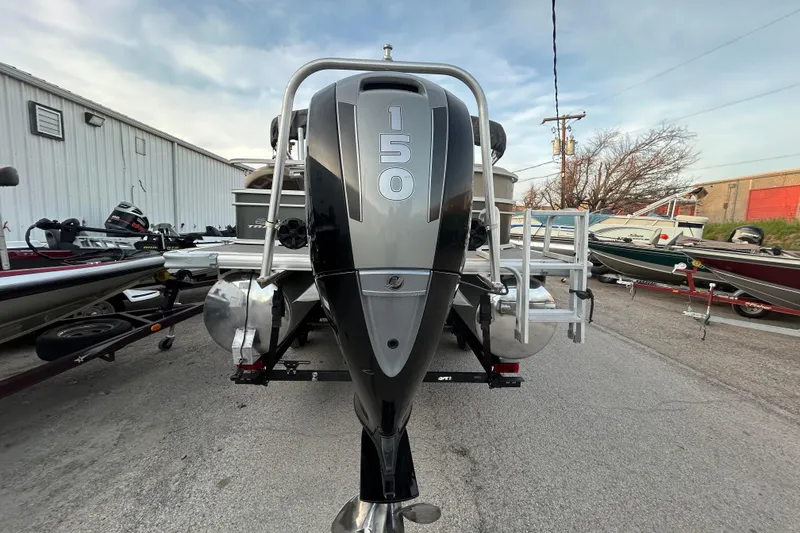 Slide: The Image of 2017 Sun Tracker Party Barge 24 DLX pontoon boat on trailer, with Mercury outboard motor. - 12