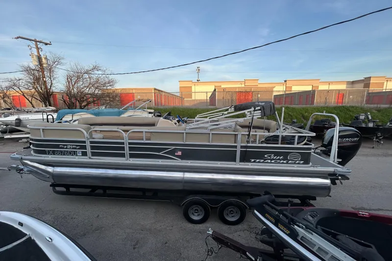 Slide: The Image of 2017 Sun Tracker Party Barge 24 DLX on trailer with Mercury outboard motor. - 15