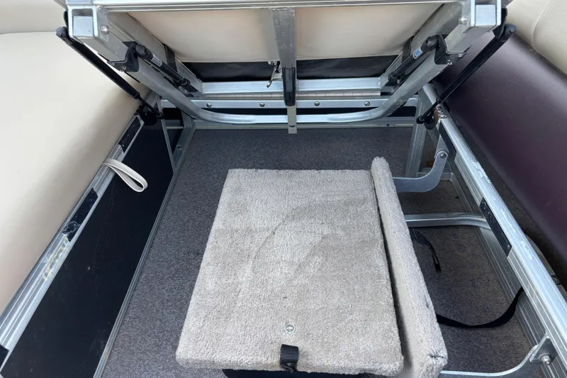 Slide: The Image of 2017 Sun Tracker Party Barge 24 DLX interior storage compartment with seating. - 53