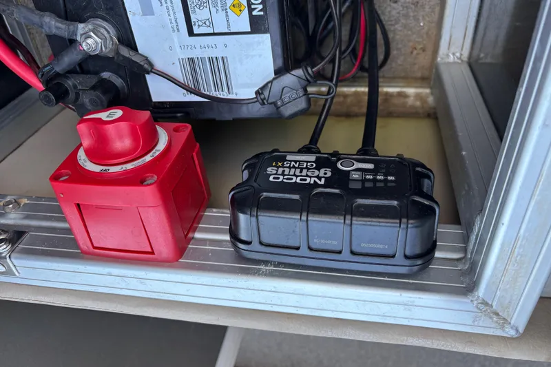 Slide: The Image of Battery switch and NOCO Genius charger in 2017 Sun Tracker Party Barge 24 DLX. - 55