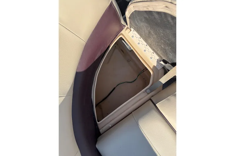 Slide: The Image of Open storage compartment on 2017 Sun Tracker Party Barge 24 DLX boat seat. - 63