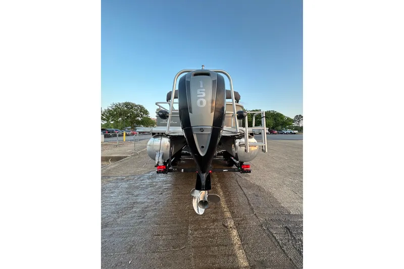 Slide: The Image of 2017 Sun Tracker Party Barge 24 DLX pontoon boat with 150 HP engine, rear view. - 65