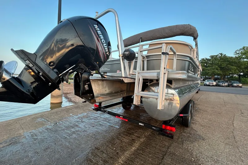 Slide: The Image of 2017 Sun Tracker Party Barge 24 DLX with Mercury outboard motor on trailer. - 70