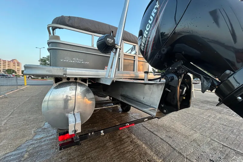 Slide: The Image of 2017 Sun Tracker Party Barge 24 DLX with Mercury outboard motor on trailer. - 71