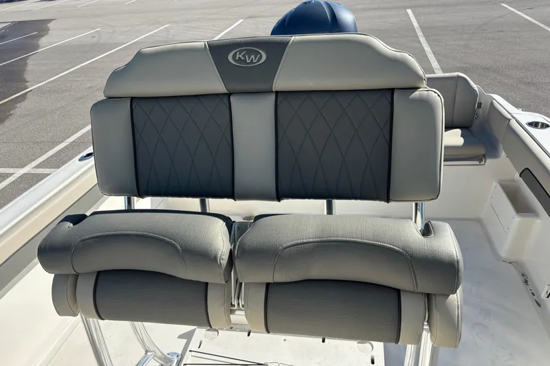 Slide: The Image of 2025 Key West 239 FS boat seating with gray upholstery in a parking lot. - 21