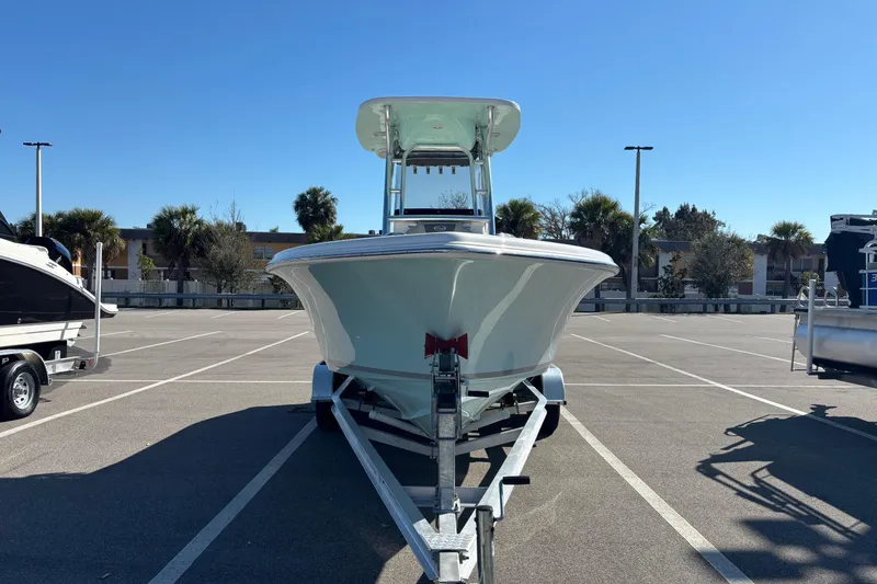 Slide: The Image of 2025 Key West 239 FS boat on trailer in sunny parking lot. - 6