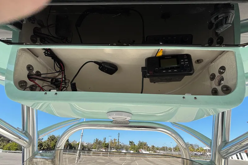 Slide: The Image of 2025 Key West 239 FS boat console with electronic equipment and wiring. - 8