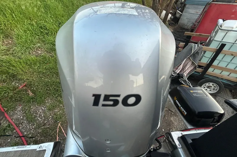 Slide: The Image of 2018 Misty Harbor 210 RF pontoon boat on trailer by a lake. - 18