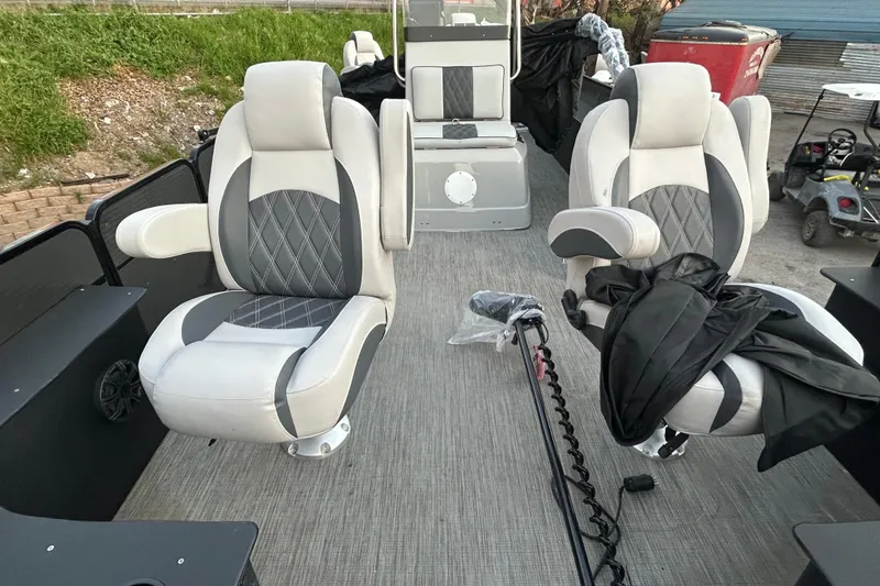 Slide: The Image of 2018 Misty Harbor 210 RF boat interior with plush seating and lake view. - 24