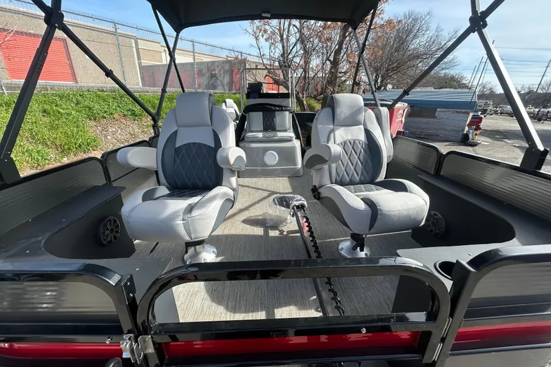 Slide: The Image of 2018 Misty Harbor 210 RF pontoon boat interior with seating and steering console. - 28