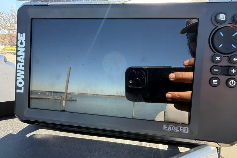 Slide: The Image of Lowrance Eagle 9 fishfinder on Misty Harbor 210 RF, 2018 model, reflecting a scenic waterfront. - 34
