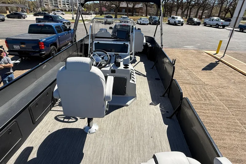 Slide: The Image of 2018 Misty Harbor 210 RF pontoon boat interior with steering console and seating. - 37