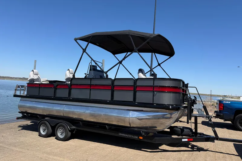 Slide: The Image of 2018 Misty Harbor 210 RF pontoon boat on trailer by the water. - 40