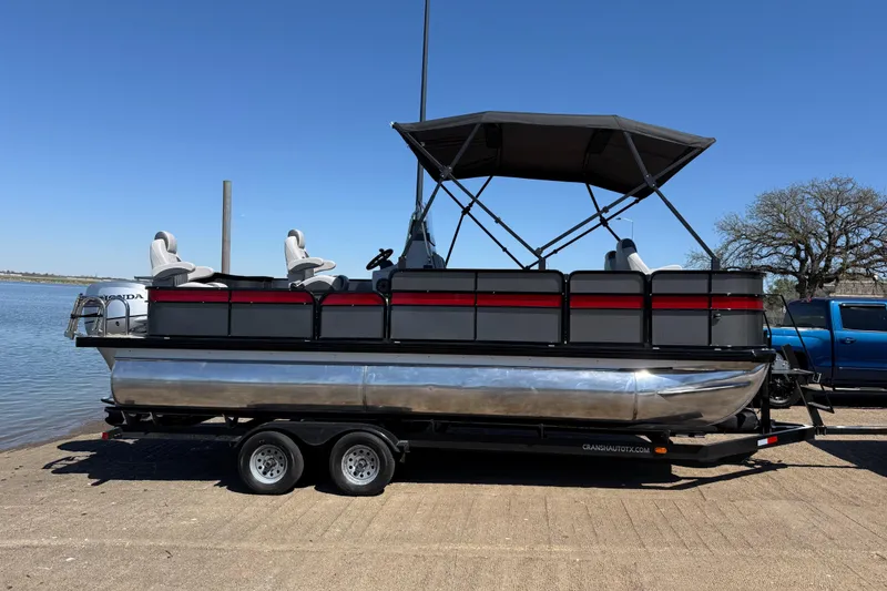 Slide: The Image of 2018 Misty Harbor 210 RF pontoon boat on trailer by a lake. - 41