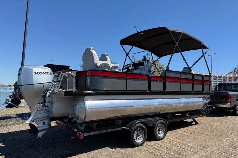 Slide: The Image of 2018 Misty Harbor 210 RF pontoon boat with Honda outboard motor on trailer. - 43