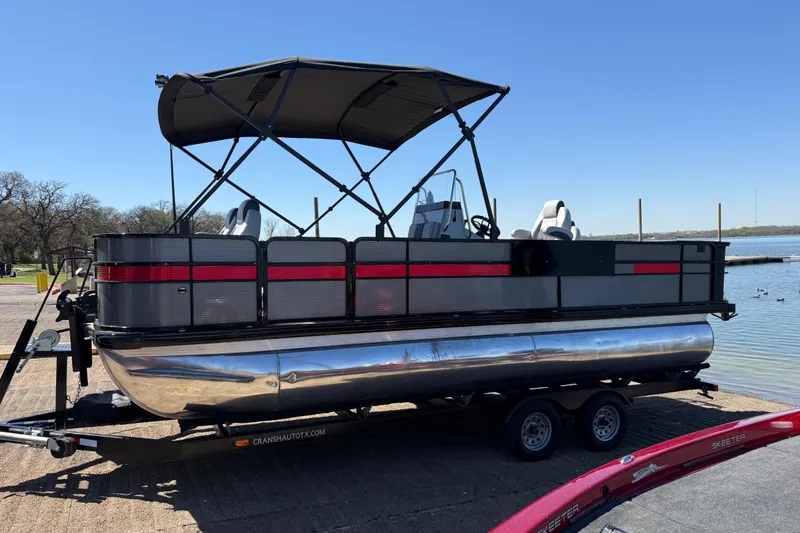 Slide: The Image of 2018 Misty Harbor 210 RF pontoon boat on trailer by a lake. - 46