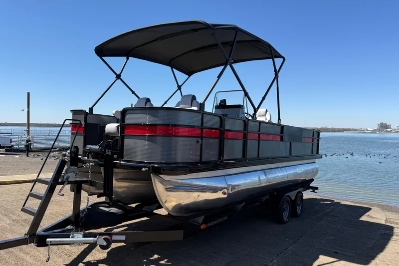 Slide: The Image of 2018 Misty Harbor 210 RF pontoon boat on trailer by a lake. - 47