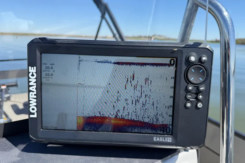 Slide: The Image of Lowrance fish finder on Misty Harbor 210 RF boat, displaying depth and speed data. - 50